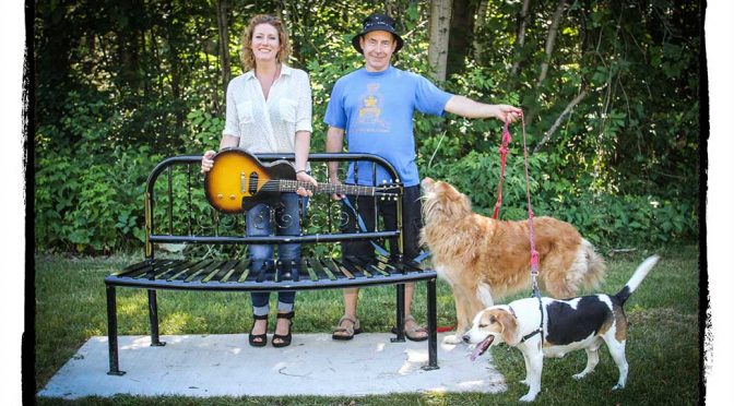 Kathleen Edwards with Russell Mason and his dogs Riggin and Beans ... along with Kathleen’s guitar. Mason found the guitar while walking his dogs in Bell Park. Barry Gray (StittsvilleCentral.ca)