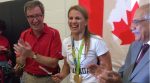 Erica Wiebe cuts the cake. Photo by Murilo Torres.