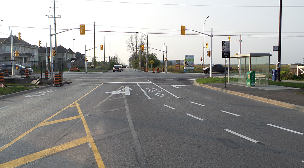 Intersection of Huntmar and Maple Grove. Heading northbound, one lane combines straight-through and left turns. The other is for right turns only.