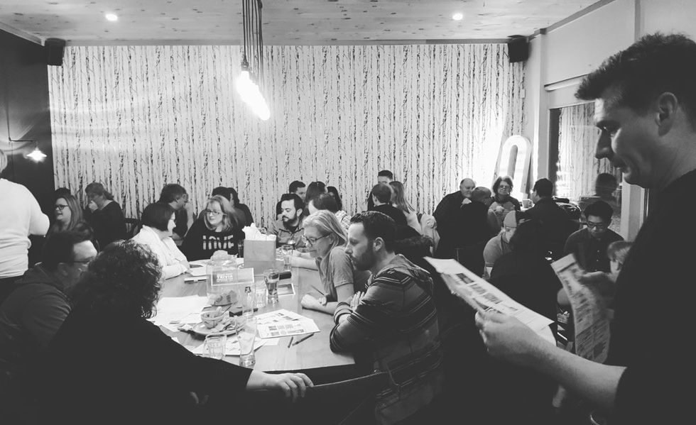 Quizmaster Rick hosts the trivia fundraiser at Quitters.